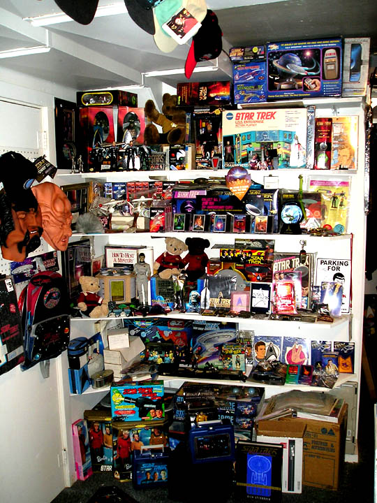 Shelves filled with Star Trek toys, models, and memorabilia