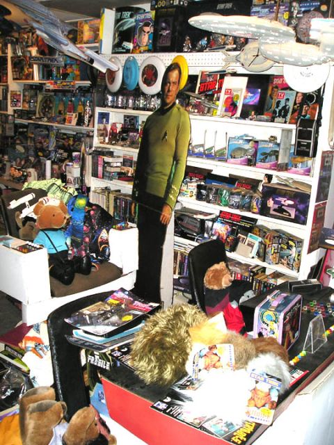 1966 Pontiac Fiero - A room is packed with Star Trek merchandise, including models of the Enterprise and various action figures.