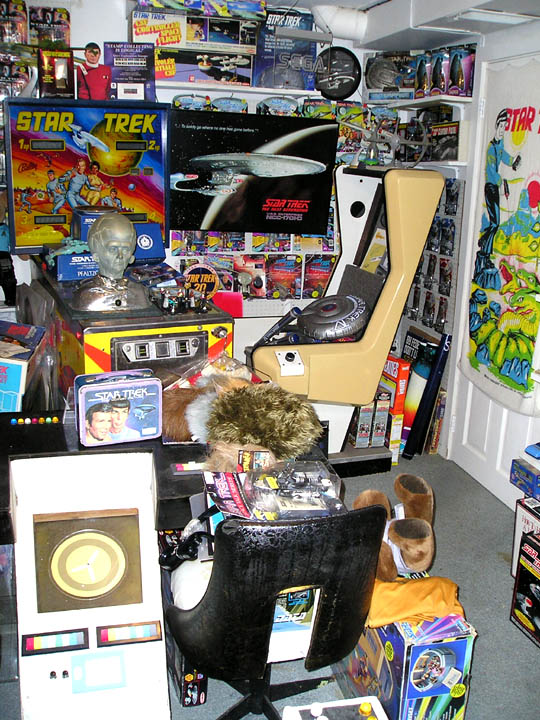 Star Trek collection with pinball machine, chair, and various toys