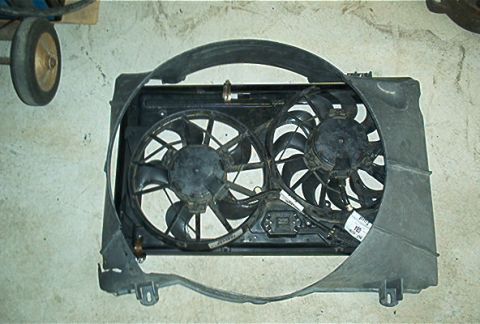 1986 Ford Bronco - A radiator fan assembly with two fans and a black plastic shroud is shown.