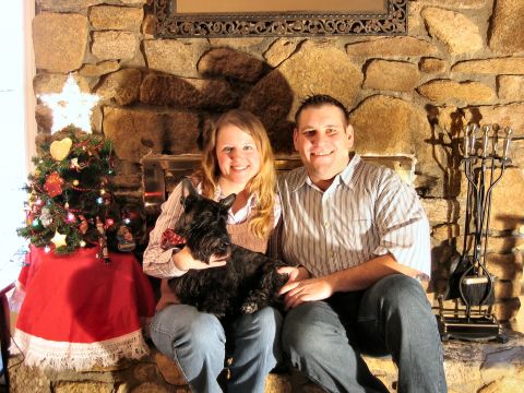 1985 Ford LTD Crown Victoria - A couple and their dog pose for a holiday photo in front of a stone fireplace.