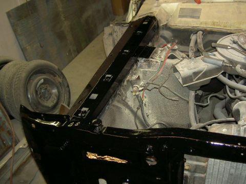 1967 Ford Ranchero - Close-up view of a vehicle's front frame and engine compartment during restoration.