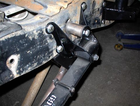 1984 Ford Bronco - This image shows the underside of a vehicle, focusing on the leaf spring and its attachment points.