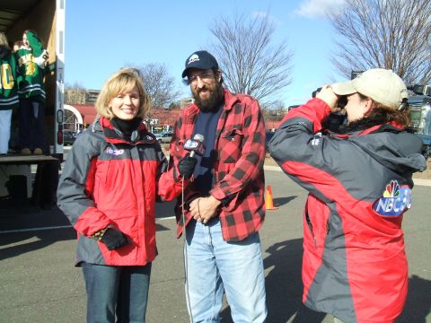 1995 Ford Bronco - A news crew from NBC30 is filming an outdoor segment with a camerawoman and two reporters.