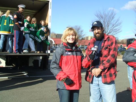 1995 Ford Bronco - A news crew interviews people in the back of a truck during an outdoor event.