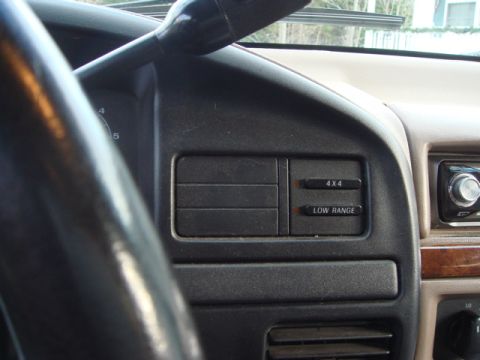 1996 Ford Bronco - Interior view of a vehicle's dashboard, showing control buttons and air vents.