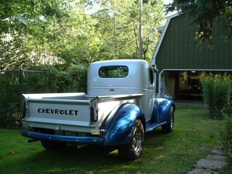 1946 Chevrolet C/K Pickup - This 1946 Chevrolet pickup truck features a two-tone paint scheme with a silver cab and blue fenders and lower body.