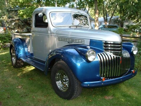 1946 Chevrolet C/K Pickup - This two-tone pickup truck has a distinctive grille and rounded fenders.