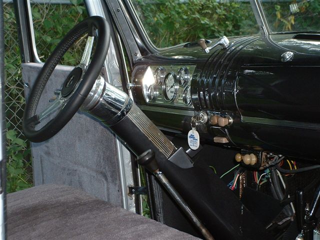 1946 Chevrolet C/K Pickup interior showing steering wheel, dashboard gauges, and shifter