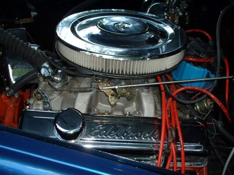 1946 Chevrolet C/K Pickup - Close-up of a modified engine Edelbrock valve covers and a chrome air cleaner assembly.