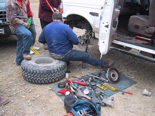 Mike fixing his rig in the parking lot.