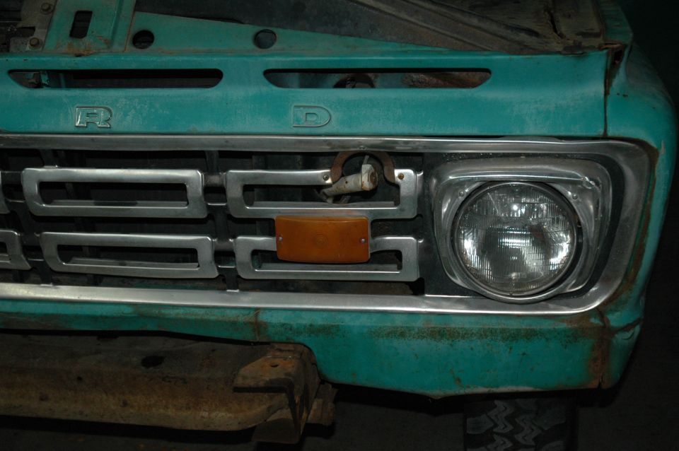 Close-up of a 1967 Ford truck grille with a padlock on it