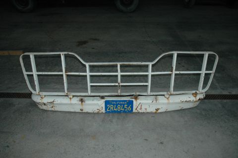 1963 Ford F-250 - A white 1963 Ford F-250 grille guard and bumper assembly is shown with a California license plate.