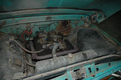 1963 Ford F-250 - Engine bay of a 1963 Ford F-250 showing the V8 engine and surrounding components.