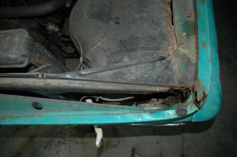 1963 Ford F-250 - Close-up of rusted fender and inner structure on a 1963 Ford F-250 truck.