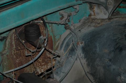 1963 Ford F-250 - Close-up of the engine bay of a 1963 Ford F-250, showing significant rust and wear.
