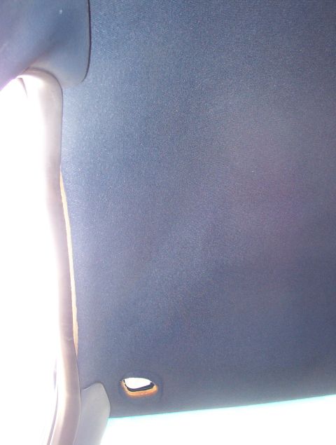 1999 Ford Crown Victoria - This '94 Grand Marquis headliner doesn't fit. It hangs too low over the doors, preventing the seals from fitting, and the grab handle holes…