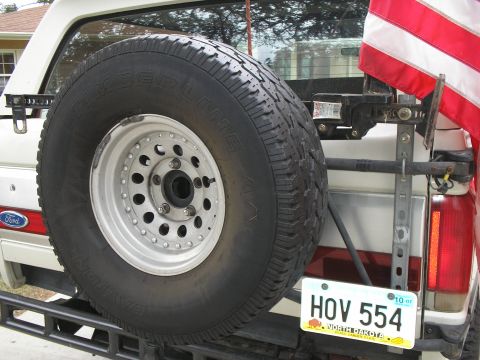 1990 Ford Bronco - Hi-lift (60") installed on the back...also the Flag mount is tried out.