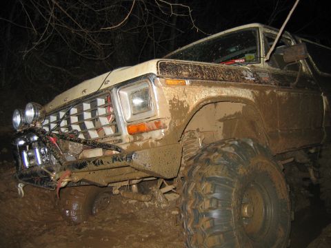 1992 Ford Mustang - This heavily mud-covered Ford F-Series truck is equipped for off-road use, auxiliary lights and large tires.