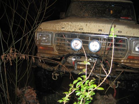 1992 Ford Mustang - Front view of a muddy 1979 Ford F-Series truck with a winch mounted on the bumper.