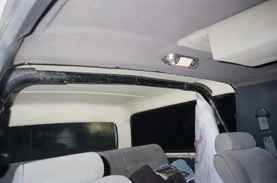 Gray headliner and black roof seal at hardtop seam inside a Bronco, with gray seats and dome light visible.