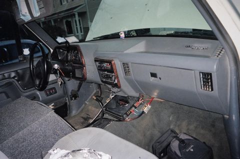1989 Ford Bronco - The interior of a 1989 Ford Bronco shows the dashboard with aftermarket audio equipment installed.