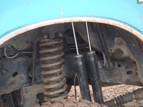 1996 Ford Bronco - Front suspension components including a coil spring and shock absorbers are visible.