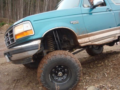 1996 Ford Bronco - This 1996 Ford Bronco features a lifted suspension and aggressive tires, ready for off-road adventures.