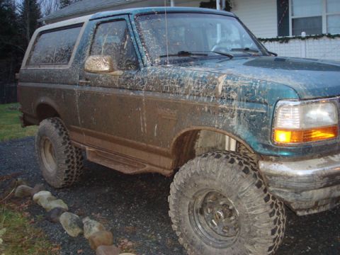 1996 Ford Bronco - This 1996 Ford Bronco is heavily covered in mud after off-road use.