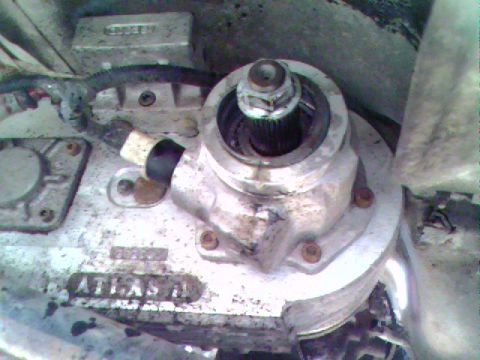 1976 GMC C/K Pickup - Detail of a transfer case component, possibly from a 4x4 vehicle, showing the 'ATLAS' marking.