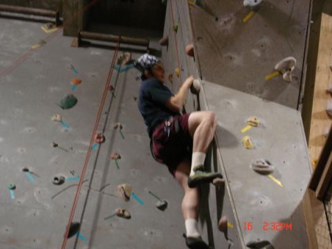 1979 Ford Bronco - A climber ascends an indoor climbing wall, with a timestamp and website overlay visible in the lower right corner.