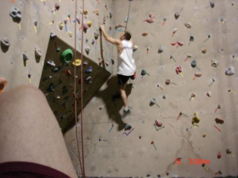 1979 Ford Bronco - Indoor climbing wall scene with a climber ascending the wall.
