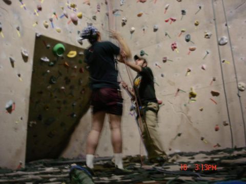 1979 Ford Bronco - Two individuals are engaged in indoor rock climbing on a textured wall with numerous colorful holds.