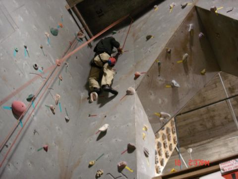 1979 Ford Bronco - A climber ascends an indoor climbing wall, with a timestamp visible in the lower right corner.