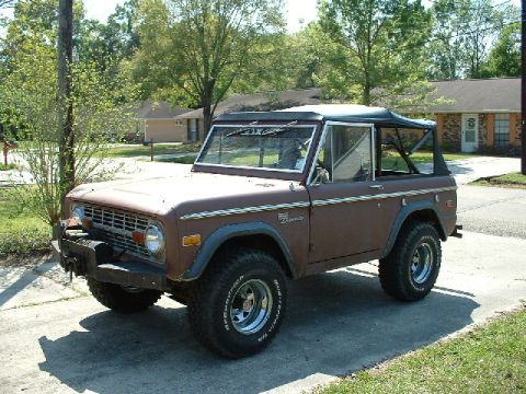 1995 Ford Bronco - This SUV is a classic model with a removable soft top and prominent fender flares.