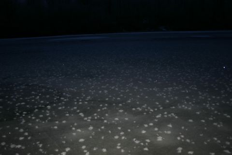 2003 Jeep TJ - Frozen surface with scattered white patches under a dark sky.