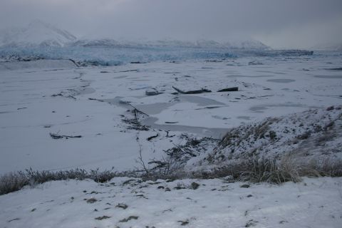 2003 Jeep TJ - Winter scene with a glacier and icy terrain under a cloudy sky.