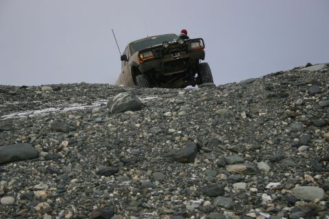 2003 Jeep TJ - Jeep TJ navigates a steep, rocky incline on what appears to be a glacier.