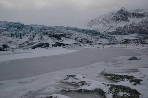 2003 Jeep TJ - A vast glacial landscape with icy formations and snow-capped peaks under an overcast sky.