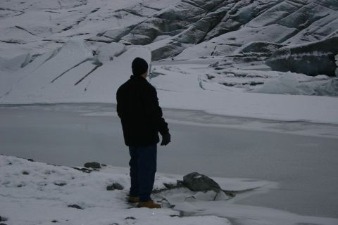 2003 Jeep TJ - A person observes a frozen landscape with a glacier in the background.
