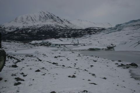 2003 Jeep TJ - Glacier and mountains under an overcast sky.