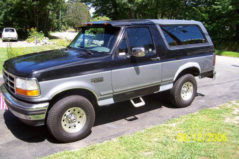 1995 Ford Bronco - This two-tone black and silver 1995 Ford Bronco is shown from a 3/4 front angle.