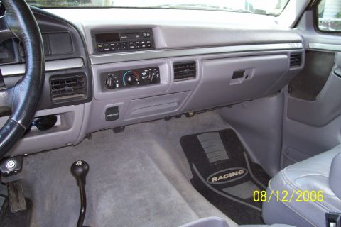 1995 Ford Bronco - Interior view of a 1995 Ford Bronco, the dashboard, steering wheel, and floor.