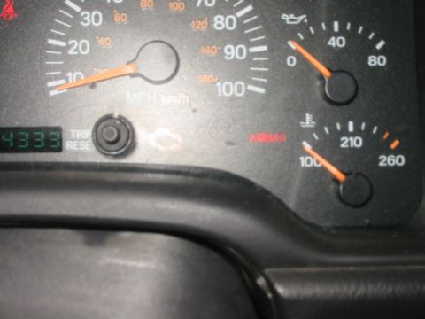 2000 Jeep Cherokee - Interior view of a vehicle's dashboard gauges, including odometer, oil pressure, and temperature readings.