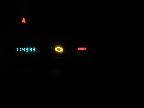 2000 Jeep Cherokee - Dashboard lights show odometer reading, check engine, and airbag warnings.