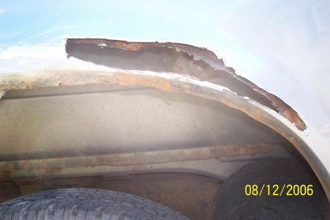 1995 Ford Bronco - Significant rust damage is visible on the interior of the wheel well, with a date stamp indicating the photo was taken on August 12, 2006.