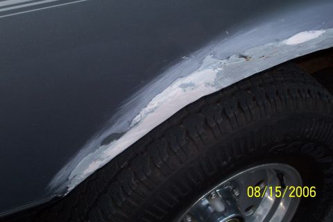 1995 Ford Bronco - Bodywork in progress on a vehicle's rear wheel well, dated 08/15/2006.
