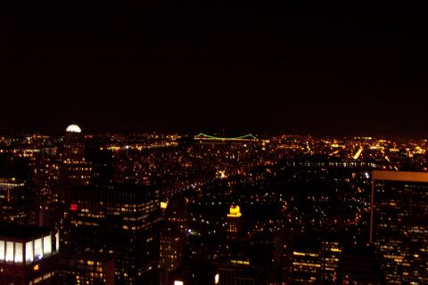 2001 Ford Crown Victoria - A urban landscape illuminated by countless lights under a dark night sky.