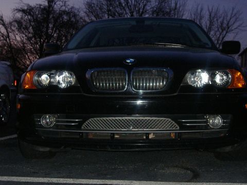 2001 BMW 3 Series - Front view of a black 2001 BMW 3 Series, its signature kidney grille and headlights.