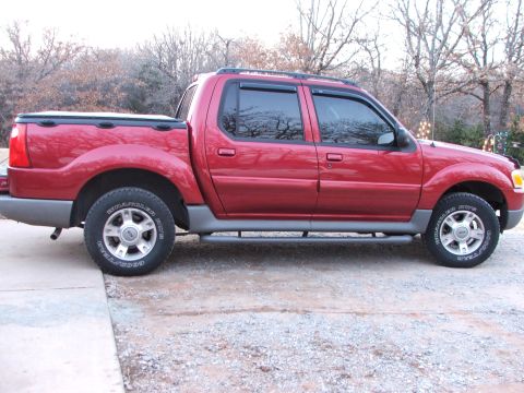 2003 Ford Sport Trac - Side view of a red 2003 Ford Sport Trac pickup truck.